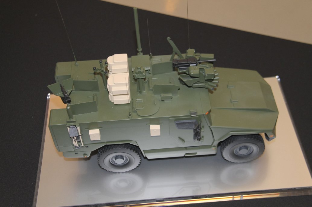 A scale model of Serval fitted with a roof-mounted remote weapon station at the front, acoustic detection system, situational awareness system, counter-improvised explosive device equipment, and pintle-mounted machine gun. (Christopher F Foss)