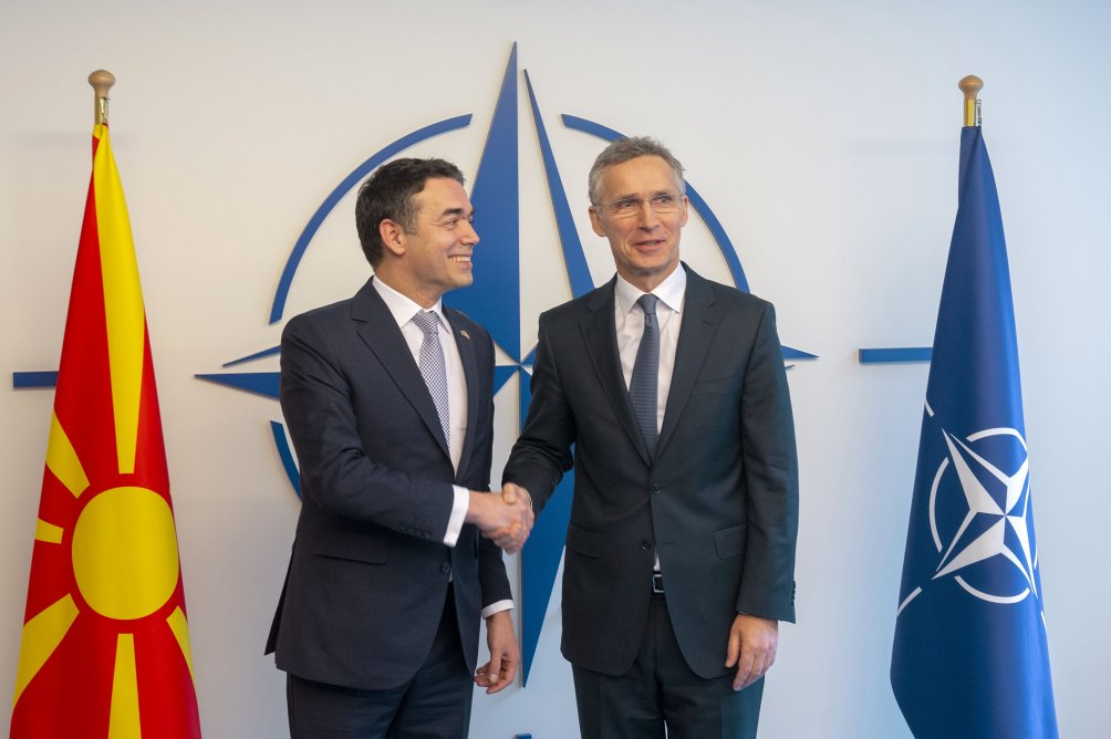 The accession protocol for Macedonian membership in NATO was signed on 6 February in the presence of the country's foreign minister, Nikola Dimitrov (left, shaking hands with Secretary General Jens  Stoltenberg). (NATO)