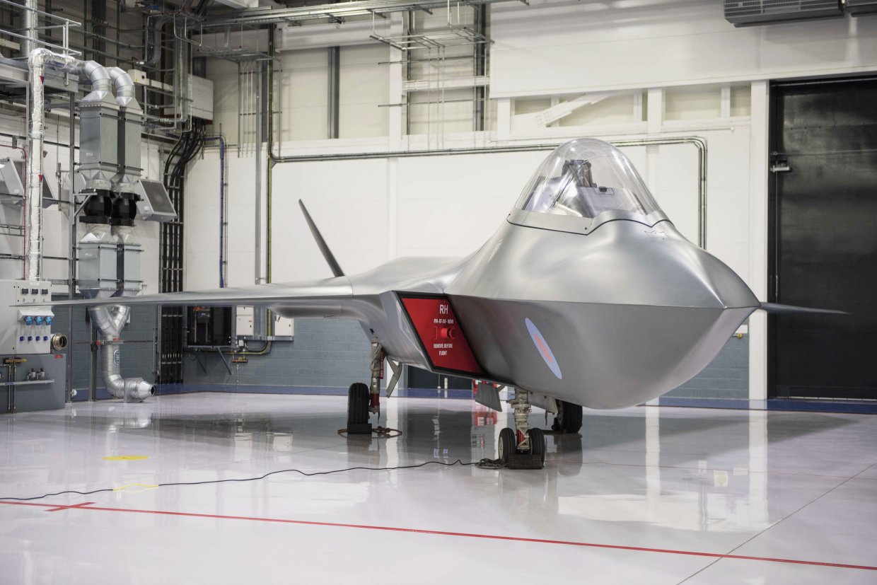 As part of the project to develop the next-generation Tempest future fighter (pictured as a mock-up), the UK is planning to team the aircraft with unmanned wingmen that will be compatible with future carrier operations. (Crown Copyright)