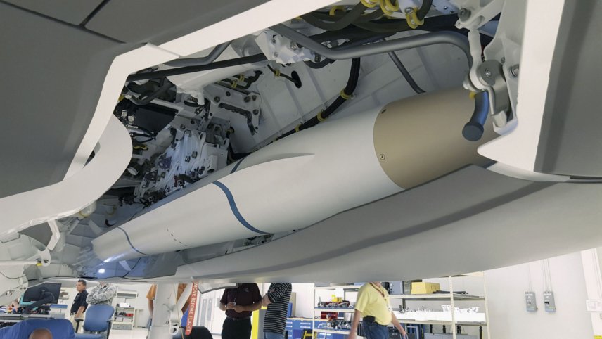 A model AARGM-ER missile being installed for a fit check into an F-35C weapons bay simulator. (Northrop Grumman)