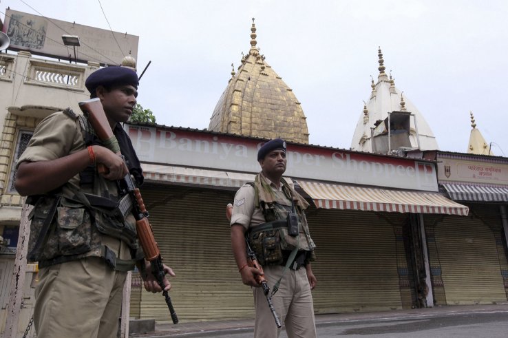 Indian security personnel stand guard next to closed shops in Jammu on 7 August. New Delhi has deployed additional security forces to Jammu and Kashmir following its 5 August decision to revoke the state’s special constitutional status. (Rakesh Bakshi/AFP/Getty Images)