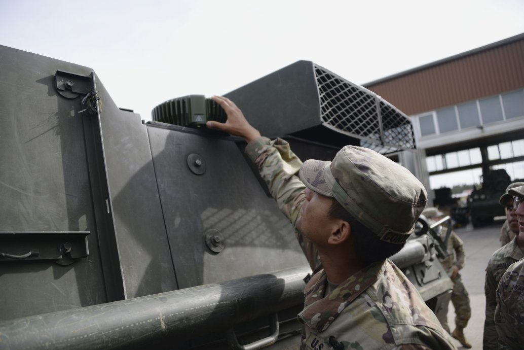 A US soldier checks part of a MAPS anti-jamming GPS device. (US Army/John Higgins)