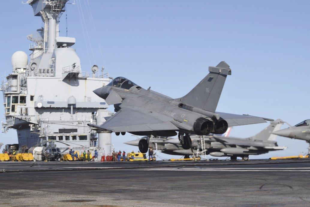 
        A French Rafale M fighter lands on
        Charles de Gaulle
        during ‘PEAN 2019’.
       (Jane’s/Emmanuel Huberdeau)