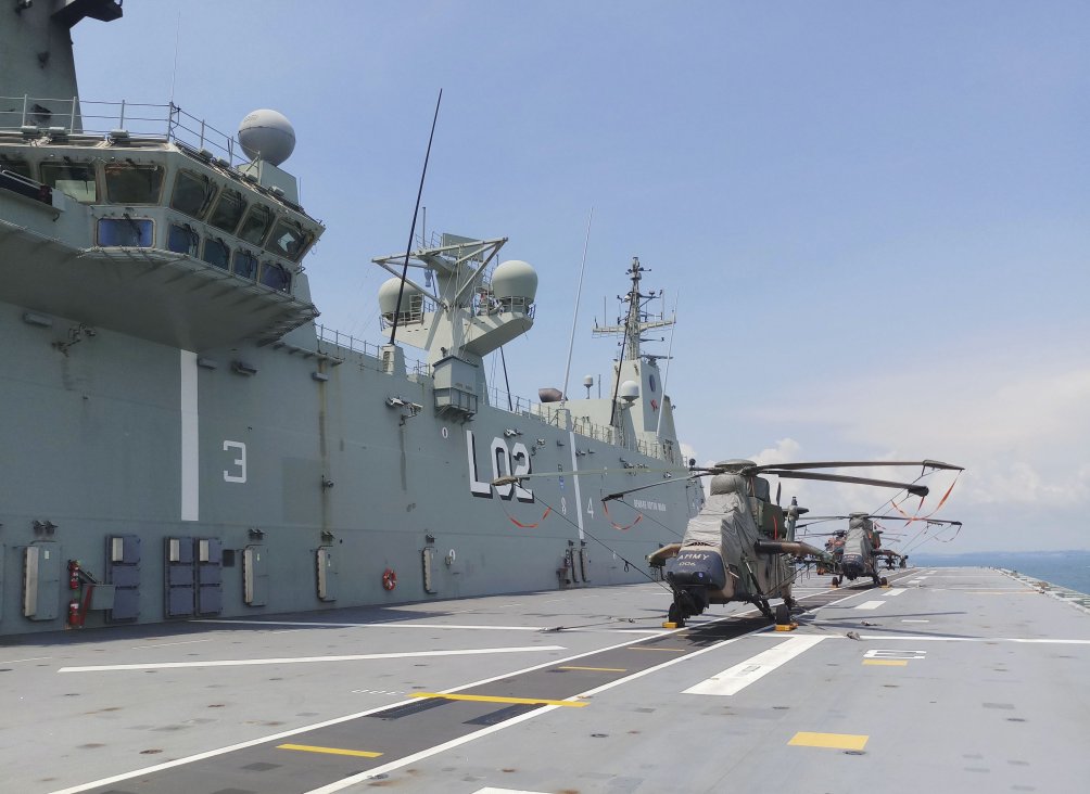 
        HMAS
        Canberra
        seen here while it was berthed at Changi Naval Base, Singapore in 2019. The ship played an instrumental role at FCP20.
       (Jane’s/Ridzwan Rahmat)