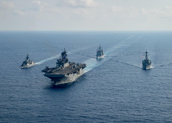 
        RAN guided-missile frigate HMAS
        Parramatta
        (FFH 154), left, sails with USN amphibious assault ship USS
        America
        (LHA 6), guided-missile cruiser USS
        Bunker Hill
        (CG 52) and guided-missile destroyer USS
        Barry
        (DDG 52) on 18 April as part of joint training activities in the South China Sea: a move that was criticised by Beijing.
       (US Navy)