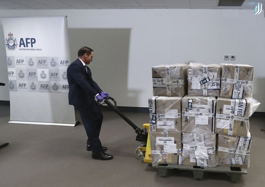 A representative from the Victorian Joint Organised Crime Taskforce wheels in 300 kg of cocaine at the Australian Federal Police Melbourne office on 30 November 2017 in Melbourne, Australia. Australian authorities made a record maritime seizure of cocaine in August 2020. (Robert Cianflone/Getty Images)