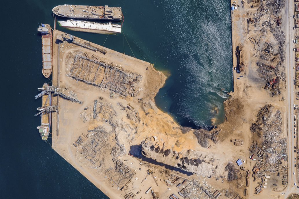 An aerial view, taken on 21 August 2020, of the aftermath of the Beirut port explosion on 4 August, showing the crater that occupies the space of the warehouse where the initial fire broke out and the ammonium nitrate was stored.   (Haytham Al Achkar/Getty Images)